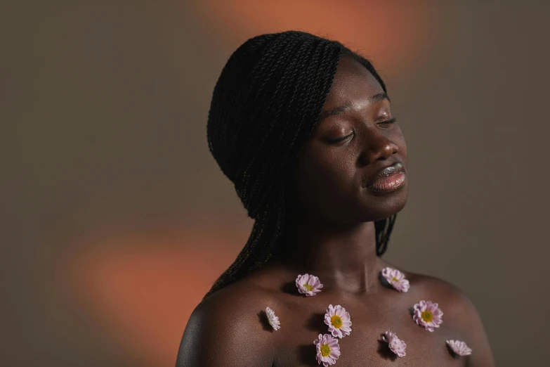 a woman with flowers on her chest, an album cover, by Lily Delissa Joseph, trending on pexels, adut akech, trypophobia acne face, oiled skin, black skin