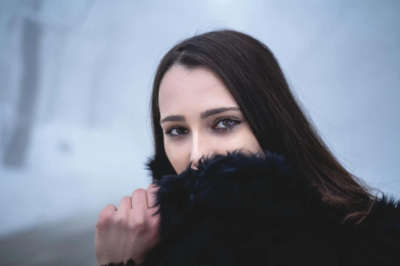 a close up of a person wearing a fur coat, a character portrait, inspired by Elsa Bleda, pexels contest winner, brunette woman, a black cloak, 🤤 girl portrait, cold weather