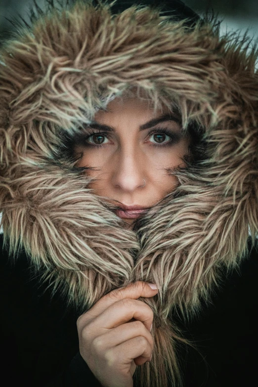 a close up of a person wearing a fur coat, inspired by Elsa Bleda, pexels contest winner, hooded cowl, 4k symmetrical portrait, color portrait, waist up portrait