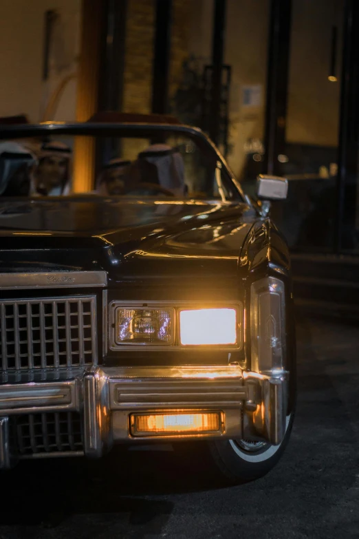 a black car parked in a parking lot at night, an album cover, pexels contest winner, swagger! lowrider culture, medium closeup, square, brown