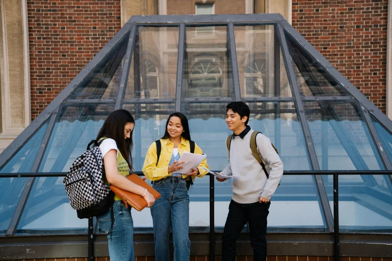 a group of people standing in front of a building, trending on pexels, academic art, canopies, background image, skylight open ceiling, high school