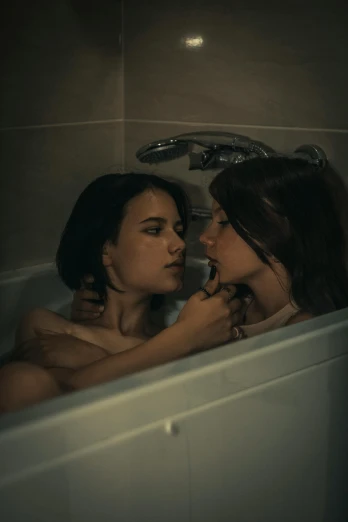two women in a bathtub looking into each other's eyes, inspired by Elsa Bleda, reddit, antipodeans, cinematic photo 4k, leaked photo, brunettes, kissing together