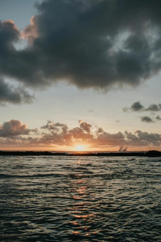 the sun is setting over a body of water, a picture, by Robbie Trevino, unsplash, romanticism, puerto rico, low quality photo, view from the sea, iceland