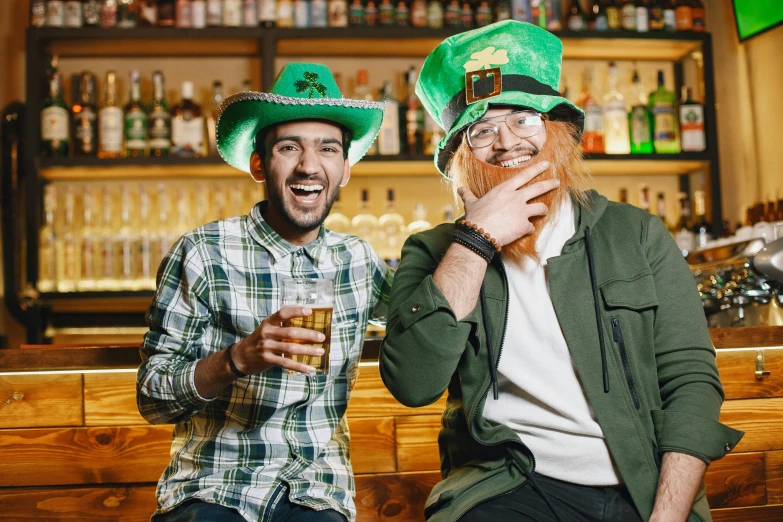 two men sitting next to each other at a bar, pexels, wearing green tophat, irish, 👰 🏇 ❌ 🍃, wearing a fancy dress