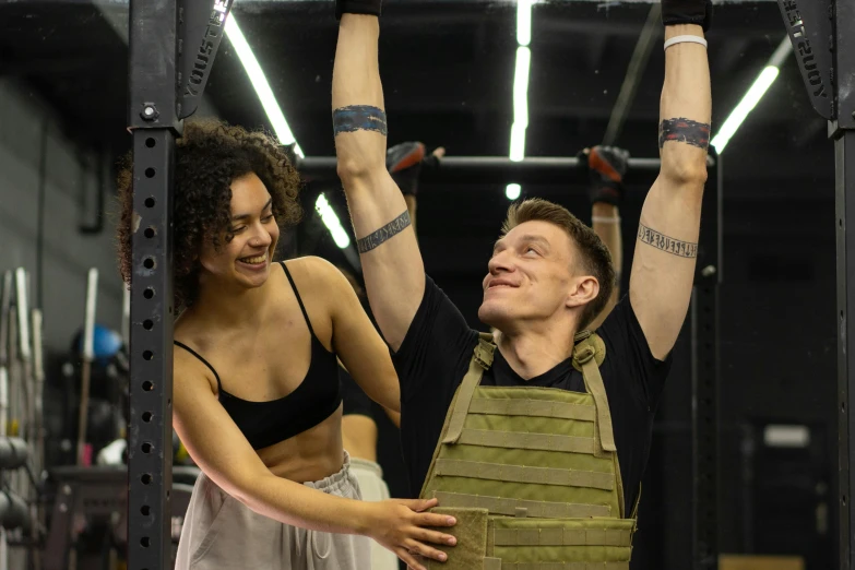 a man and a woman doing pull ups in a gym, by Emma Andijewska, orc themed, militaristic, ernest khalimov body, profile image