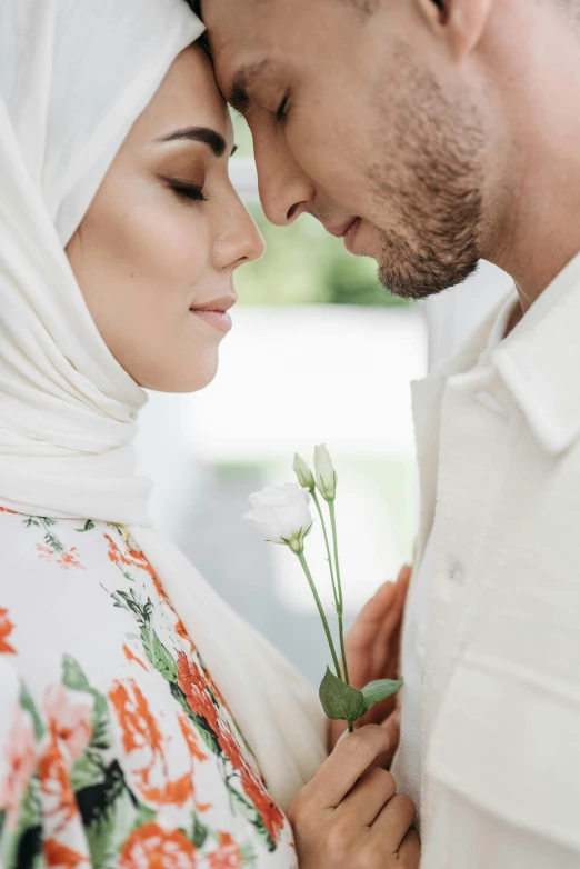 a man and woman standing next to each other, hurufiyya, wholesome, intimate, covered, female