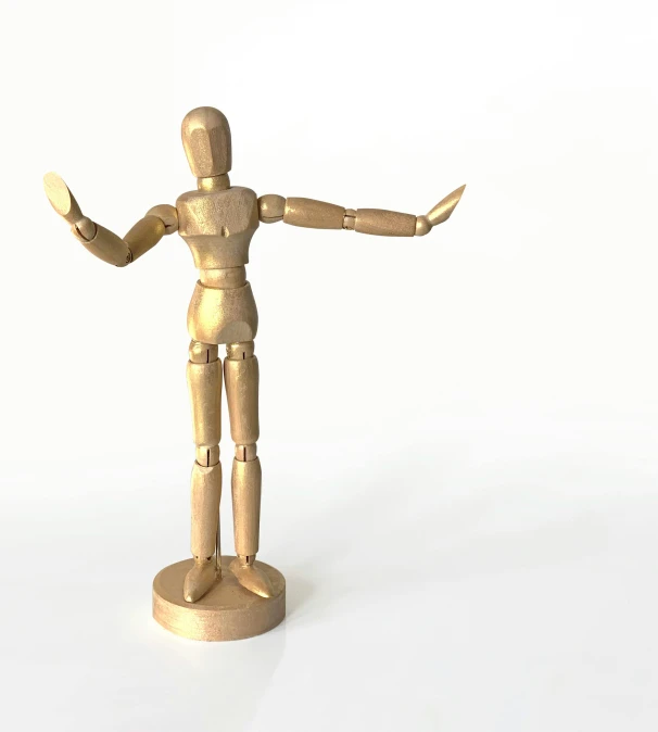 a wooden mannequin standing on a white surface, arms out, sculpture made of gold, from a movie scene, medium poly