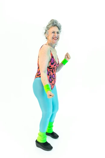 a woman holding a tennis racquet in one hand and a tennis racquet in the other, by Pamela Drew, happening, in spandex suit, neon aztec, 5 5 yo, rollerskaters