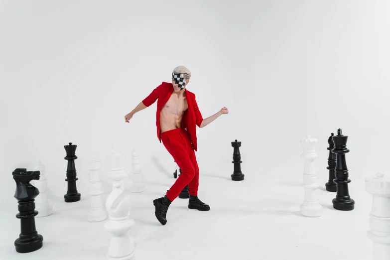 a man in a red suit is surrounded by chess pieces, an album cover, inspired by Horace Vernet, pexels contest winner, antipodeans, full body photoshoot, old man doing with mask, lil peep, youtube thumbnail