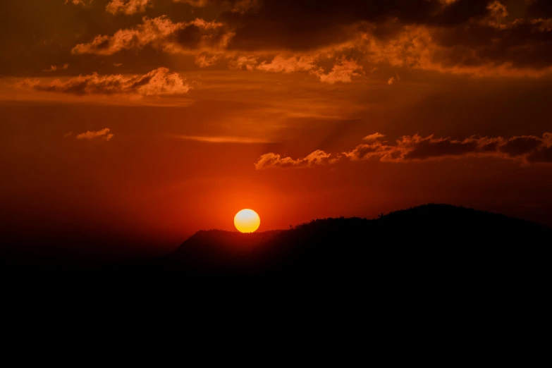 the sun is setting in the sky over the mountains, pexels contest winner, romanticism, big red sun, black, post processed, brown