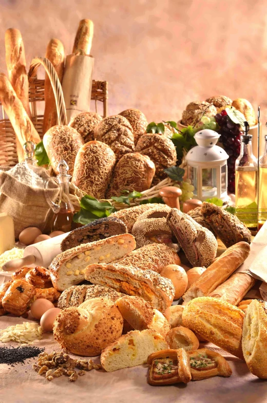 a table topped with lots of different types of bread, screensaver, mediterranean features, skyline, seeds