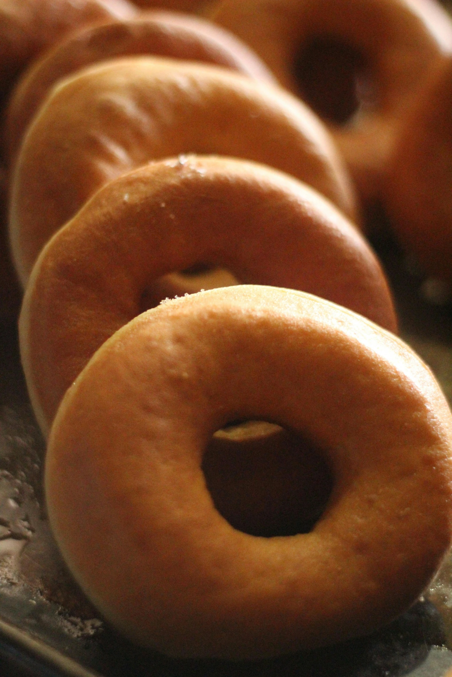 a close up of a tray of doughnuts, by Ben Zoeller, hurufiyya, null, chile, the photo shows a large, hires