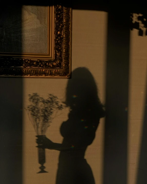 a shadow of a woman holding a vase of flowers, trending photo, ((portrait)), in a museum room, (golden hour)