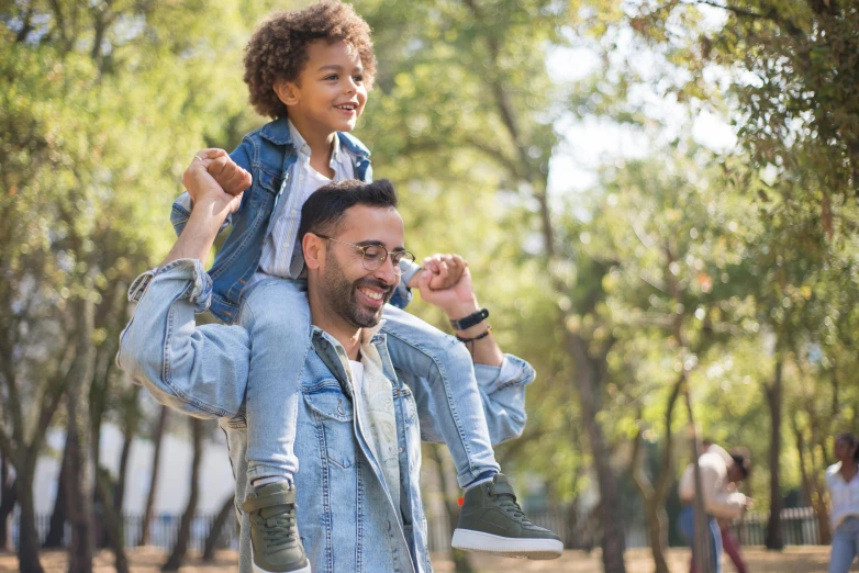 a man carrying a little girl on his shoulders, pexels, avatar image, denim, at the park on a beautiful day, boys