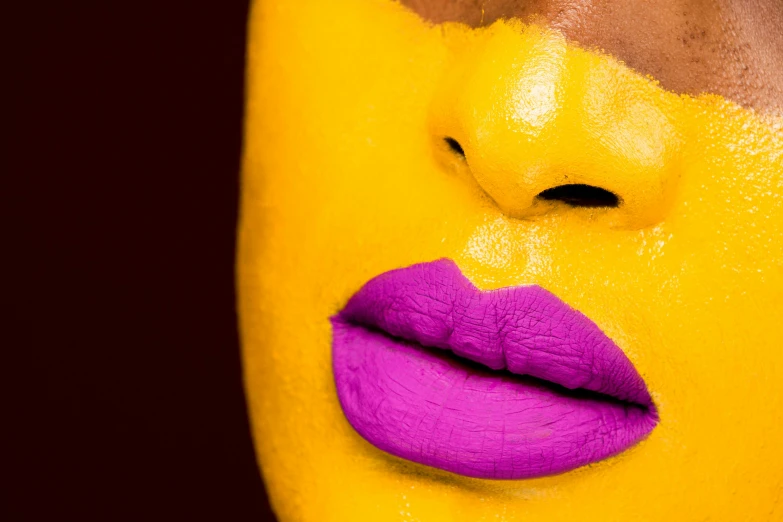 a close up of a person's face painted in yellow and purple, inspired by Bert Stern, trending on pexels, afrofuturism, sexy lips :5 stylish, mustard, no face, glowing magenta face