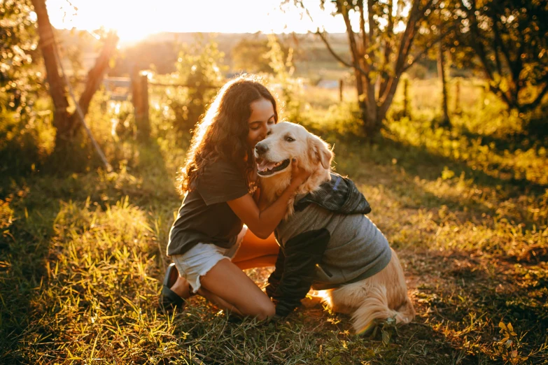 a woman sitting in the grass with her dog, pexels, warm golden backlit, australian, embrace, 15081959 21121991 01012000 4k