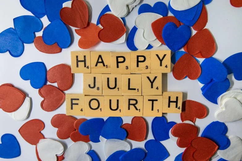 a scrabble spelling happy july fourth surrounded by red, white and blue confetti, by Carey Morris, pexels, folk art, background image, playing card suit hearts, square, f / 4