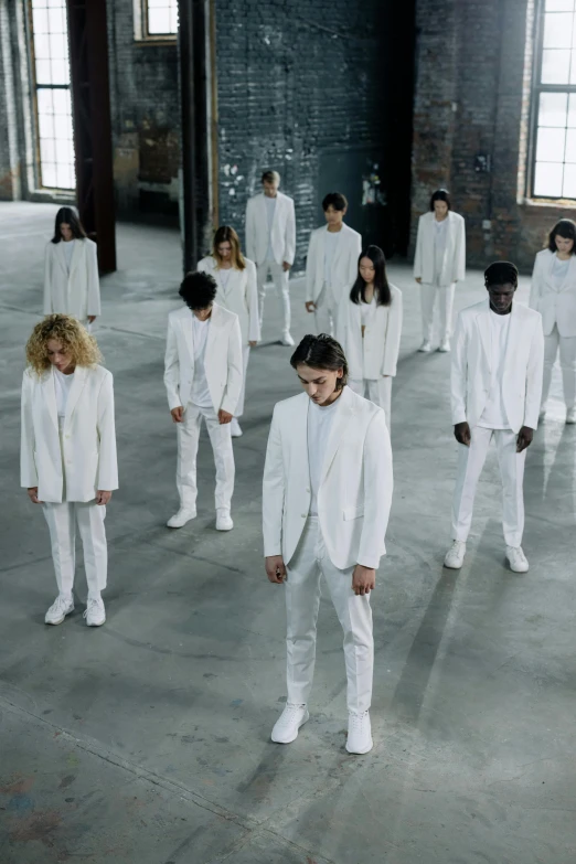 a group of people dressed in white standing in a room, inspired by Vanessa Beecroft, antipodeans, heilung, promotional image, airplane, full height