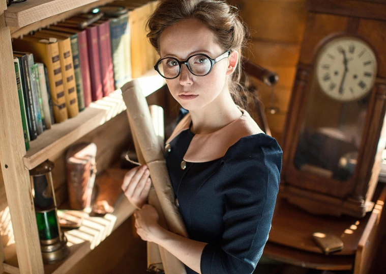 a woman standing in front of a bookshelf holding a bat, a portrait, inspired by Hermione Hammond, pexels contest winner, square rimmed glasses, maxim sukharev, as a strict school teacher ), high quality image