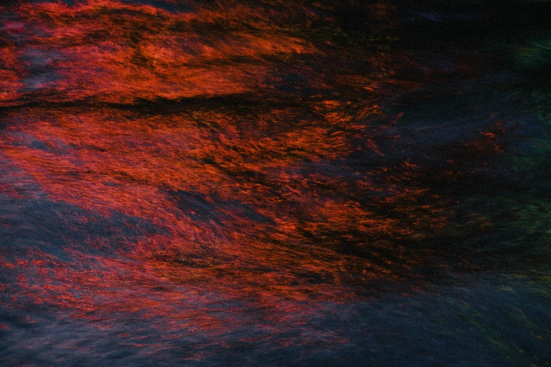 a person riding a surf board on top of a wave, an album cover, inspired by Anna Füssli, pexels contest winner, lyrical abstraction, red glowing streams of lava, reflections on the river, mat collishaw, red paint detail