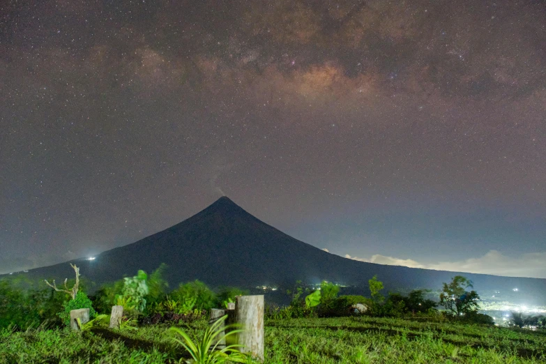 a night sky with a mountain in the background, by Julia Pishtar, pexels contest winner, sumatraism, pyramid surrounded with greenery, volcano valley, background image, philippines