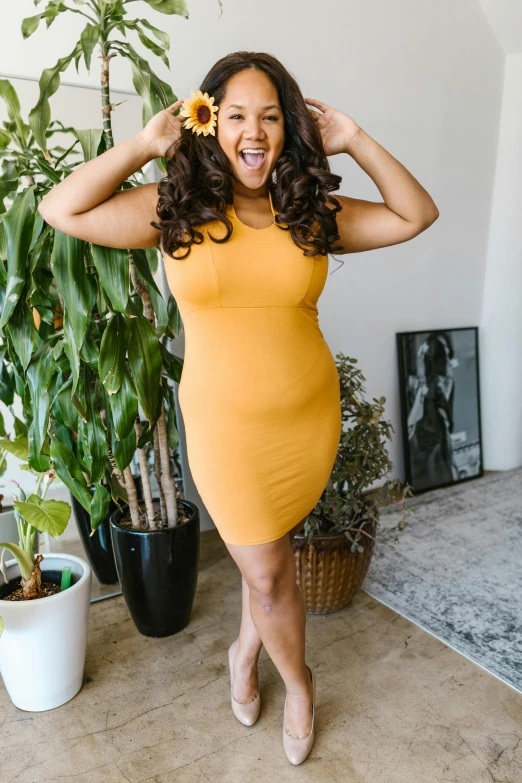 a woman in a yellow dress posing for a picture, thicc build, official product photo, all overly excited, karla ortiz