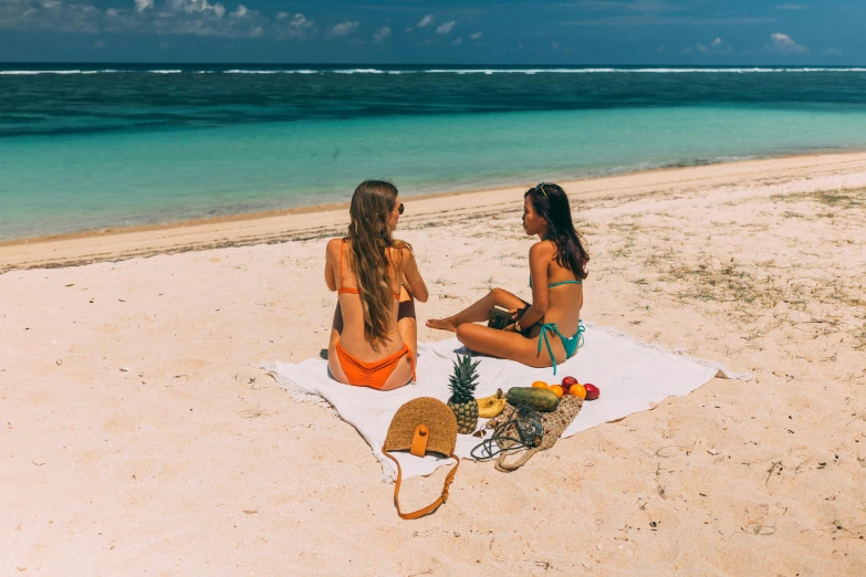 a couple of women sitting on top of a sandy beach, flatlay, moana, on the beach at noonday, profile image