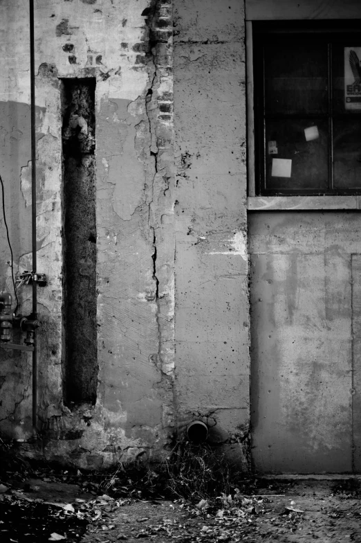 a black and white photo of a fire hydrant, a black and white photo, inspired by Arnold Newman, location ( favela _ wall ), windows and walls :5, made of cement and concrete, gritty image