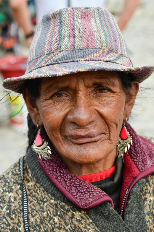 a close up of a person wearing a hat, pexels contest winner, peru, older woman, young himalayan woman, old male