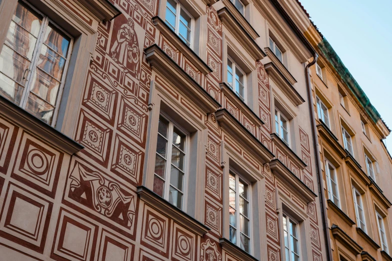 a clock that is on the side of a building, by Emma Andijewska, renaissance, red ocher, decorative panels, warsaw, profile image