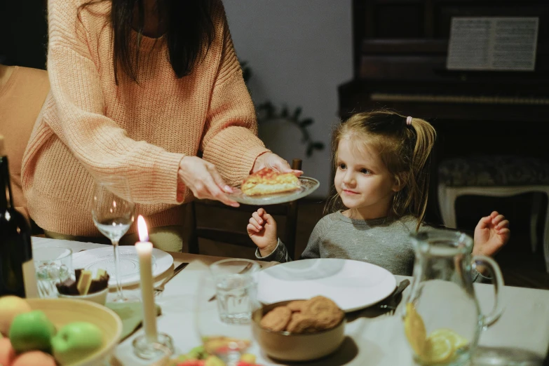 a woman serving a piece of cake to a little girl, by Adam Marczyński, pexels contest winner, dinner table, avatar image, seasonal, blank