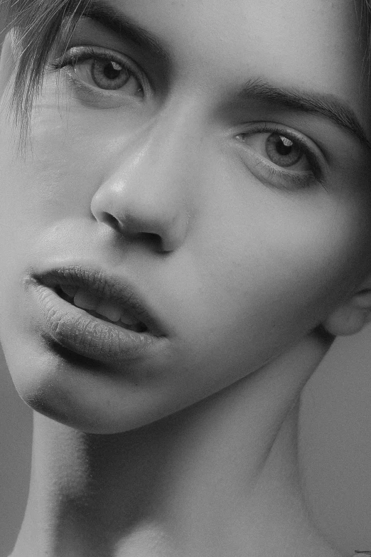 a black and white photo of a woman, inspired by irakli nadar, hyperrealism, pale thin lips, androgyny, square facial structure, monochrome 3 d model