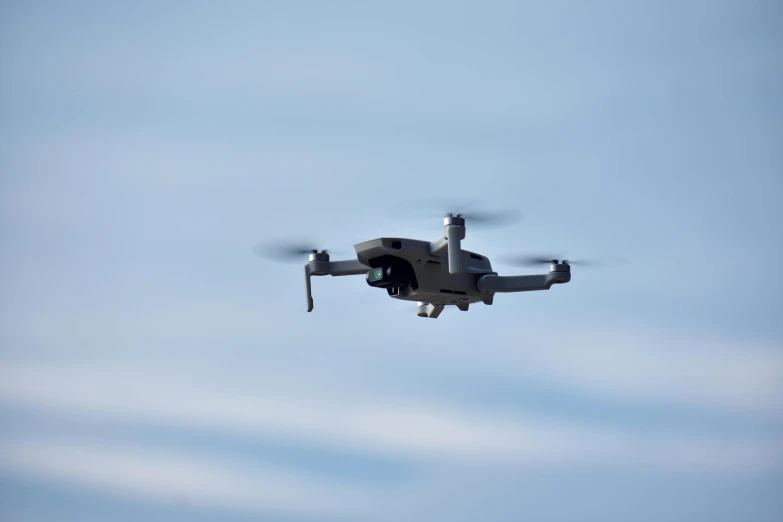 a small propeller plane flying through a blue sky, a portrait, pexels contest winner, hurufiyya, police drones, square, grey, computer