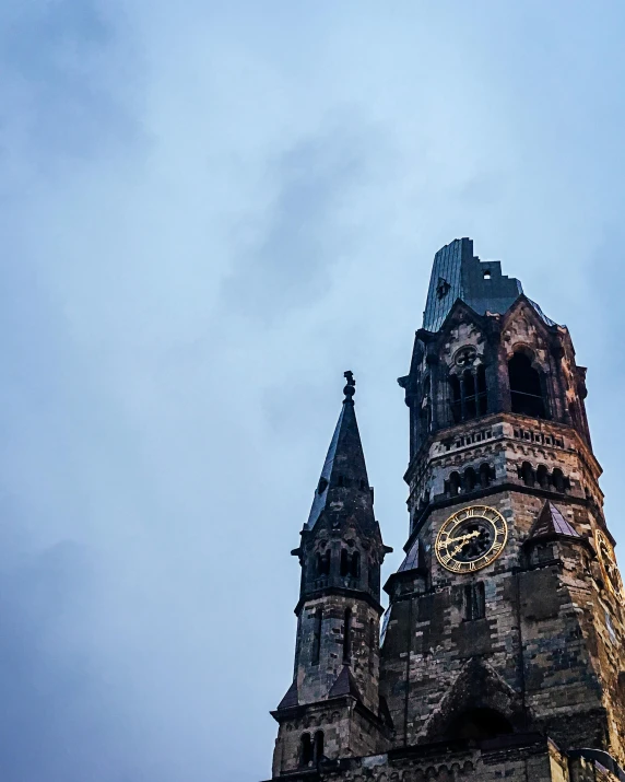 a very tall building with a clock on it's side, by Jacob Burck, pexels contest winner, romanesque, spire, panoramic shot, color photo, grey