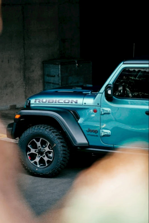 a blue jeep parked on the side of a road, profile image, ((greenish blue tones)), upper body close - up, rugged details