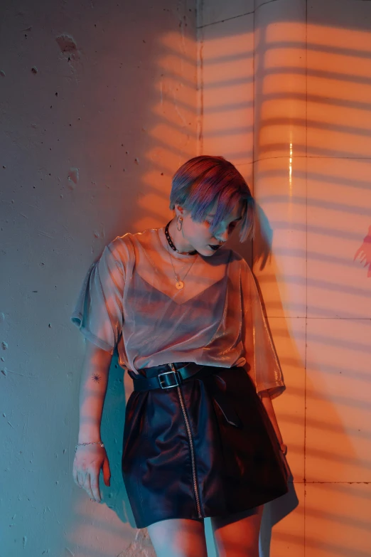 a woman standing next to a wall in a room, an album cover, inspired by Elsa Bleda, trending on pexels, cai xukun, hero pose colorful city lighting, grunge aesthetic!!! (, mesh shirt