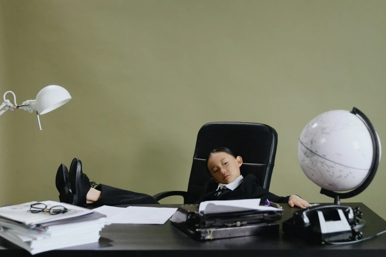 a figurine of a man sitting at a desk, a cartoon, by Fei Danxu, pexels contest winner, asleep, medium shot of two characters, business attire, little kid