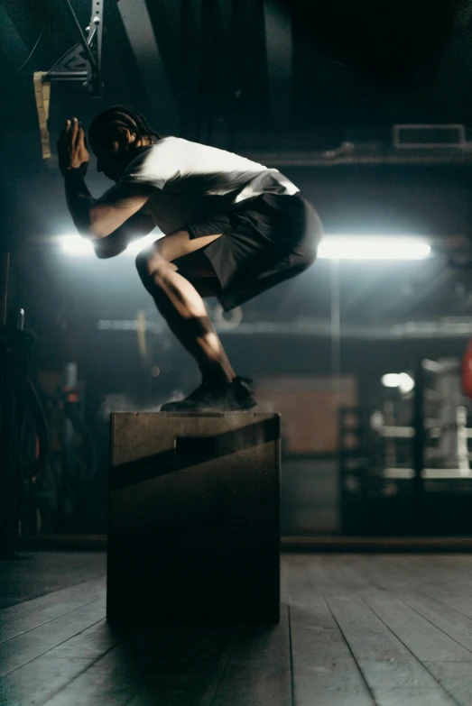 a man flying through the air while riding a skateboard, pexels contest winner, happening, in a gym, standing on a ladder, athletic crossfit build, mid night