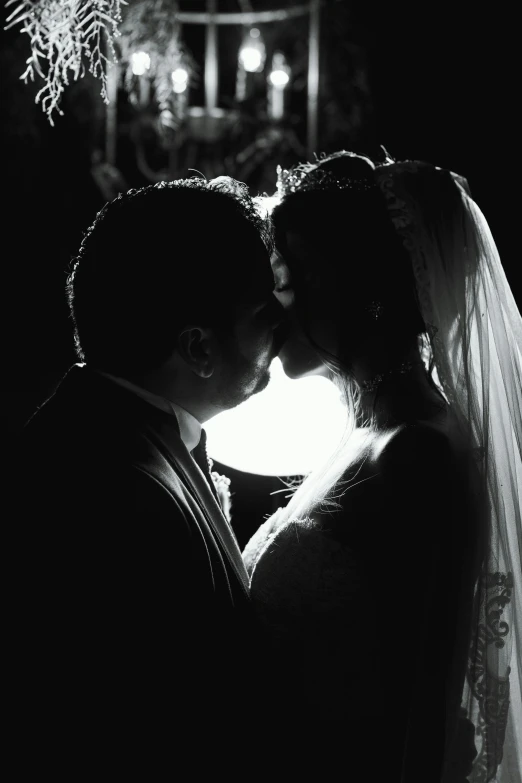a black and white photo of a bride and groom, by Robbie Trevino, pexels, romanticism, backlit!!, taken in the late 2000s, instagram picture, profile picture