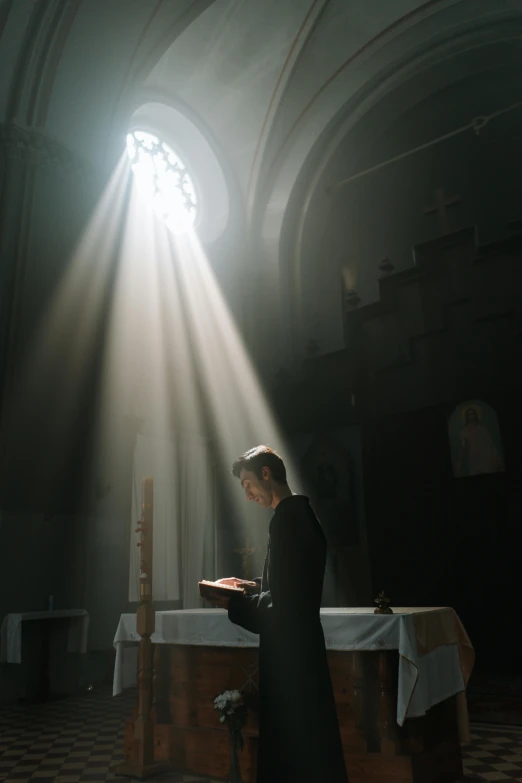 a man standing in front of a table in a church, unsplash contest winner, light and space, priest, light over boy, 15081959 21121991 01012000 4k, ignant