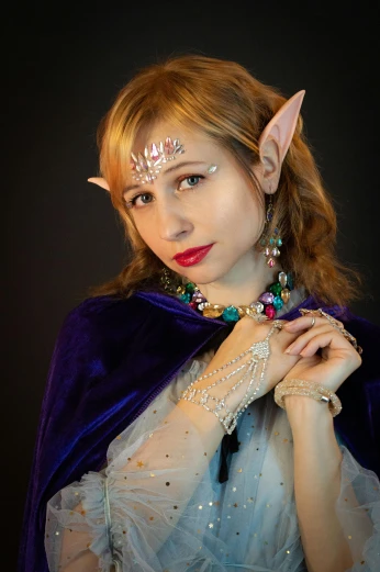 a woman dressed as a elf poses for a picture, a character portrait, featured on reddit, renaissance, headshot photo, jewelled, star guardian inspired, bone jewellery
