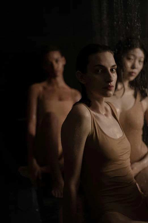 a group of naked women standing next to each other, a portrait, inspired by Vanessa Beecroft, unsplash, antipodeans, 3 actors on stage, soaked, still image from tv series, [ theatrical ]