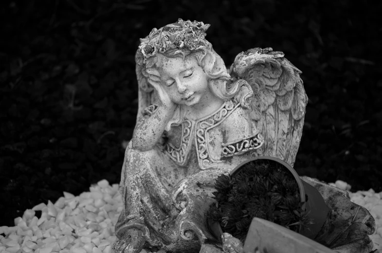 a black and white photo of a statue of an angel, a statue, relaxing, many small details, biblically acurate angel, young wan angel