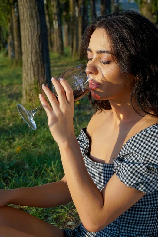 a woman sitting on the ground drinking a glass of wine, pexels contest winner, renaissance, forest picnic, profile image, sunbathed skin, latina