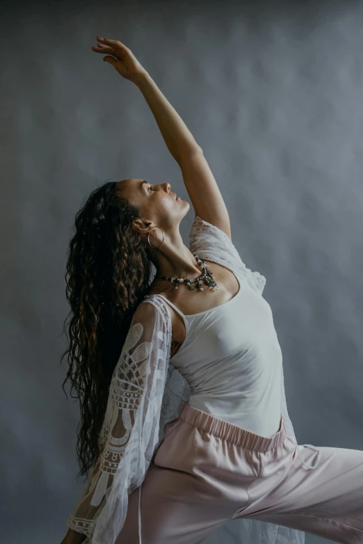 a woman in a white top and pink pants doing a yoga pose, a portrait, by Elizabeth Polunin, pexels contest winner, arabesque, wavy hair spread out, large)}], arms out, high delicate details