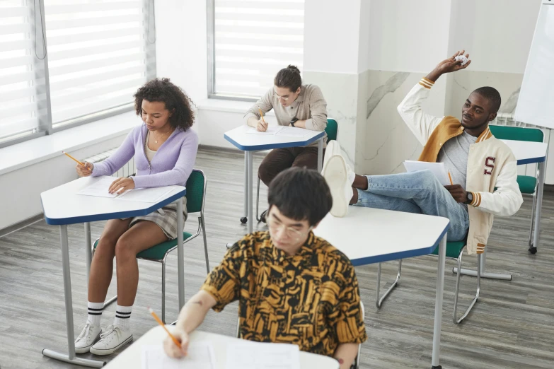 a group of children sitting at desks in a classroom, trending on pexels, hyperrealism, academic clothing, sitting on top a table, diverse, test