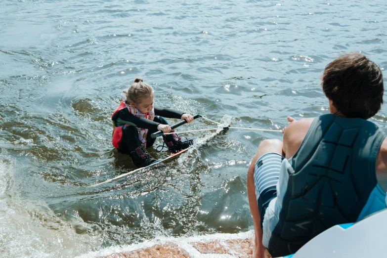 a couple of people that are in the water, pexels contest winner, hurufiyya, holding a bow, greta thunberg, families playing, cardboard