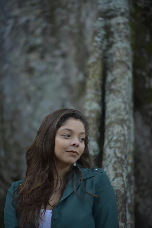 a woman standing next to a tree in a forest, an album cover, unsplash, renaissance, miranda cosgrove, ((portrait)), color photograph portrait 4k, alanis guillen