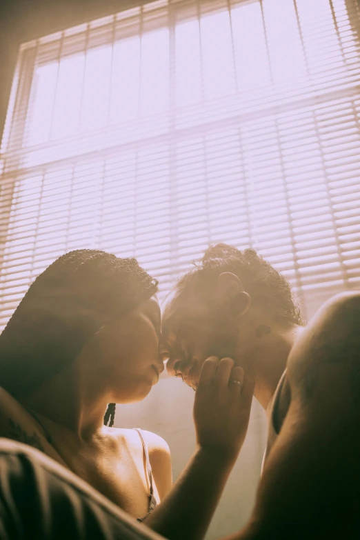 a man and a woman kissing in front of a window, pexels contest winner, sunfaded, bisexual lighting, mouth agape, :: morning