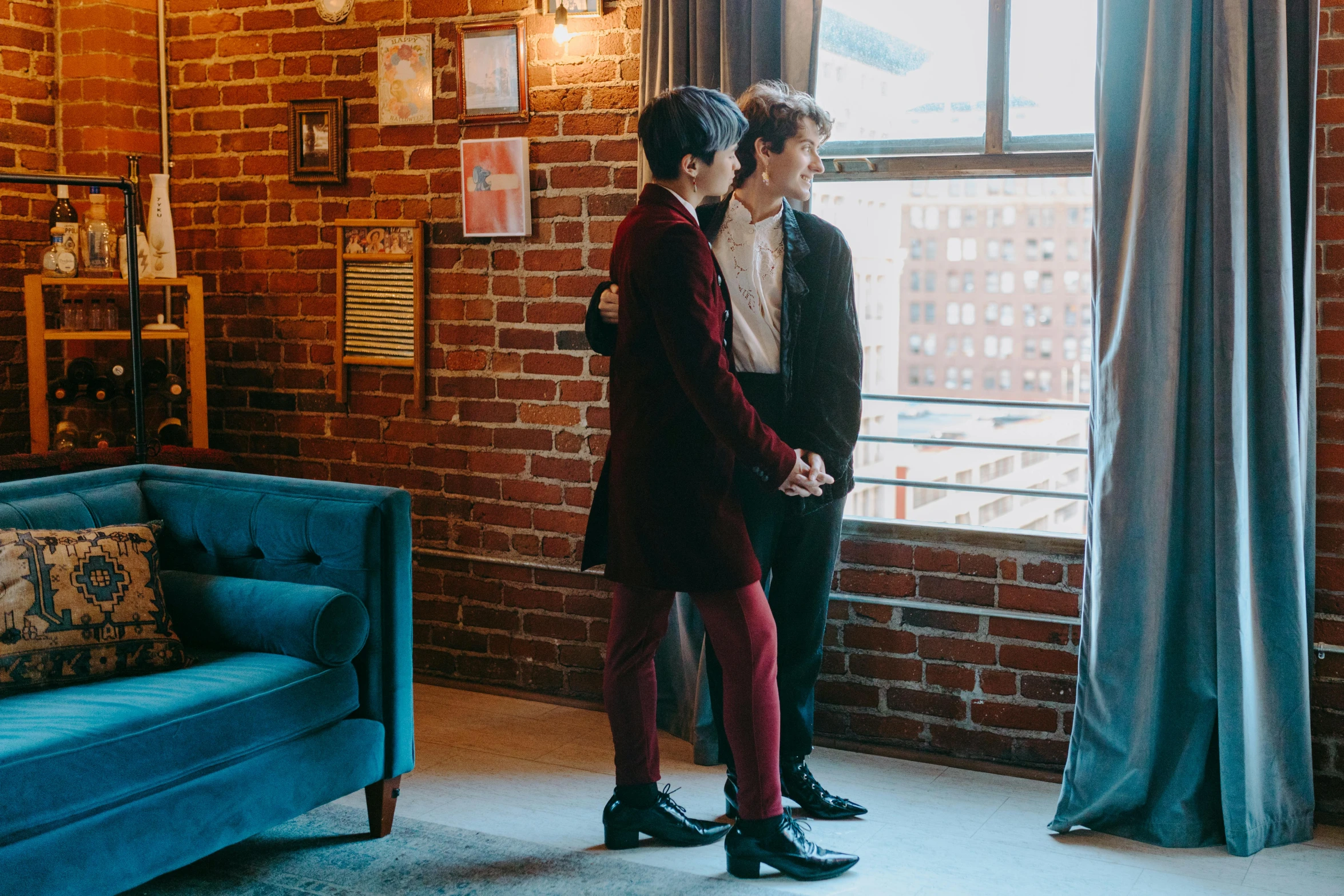 a couple of people standing in front of a window, by Winona Nelson, unsplash, red tailcoat, two buddies sitting in a room, walking to the right, dylan kowalsk